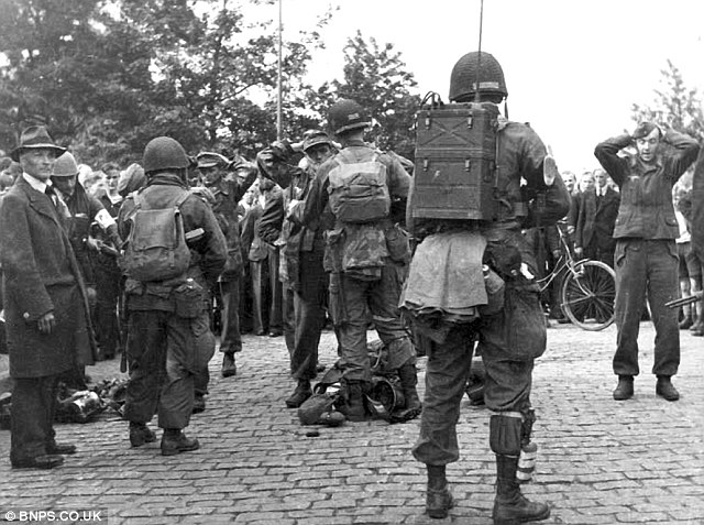 The black and white snaps depict scenes of jubilation among the local residents who had just endured four years and four months of Nazi occupation.jpg